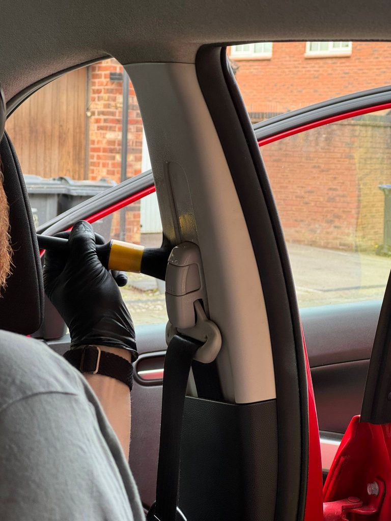 Interior seat belt clean